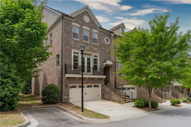 townhome / multi-family property featuring a garage