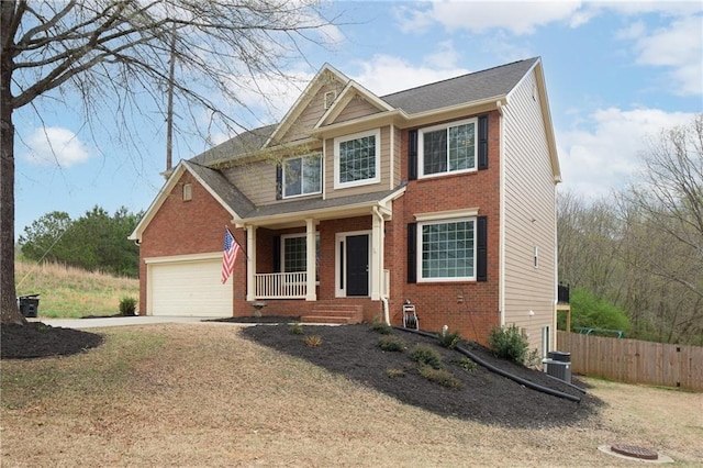 view of front of property featuring brick siding, an attached garage, fence, and concrete driveway