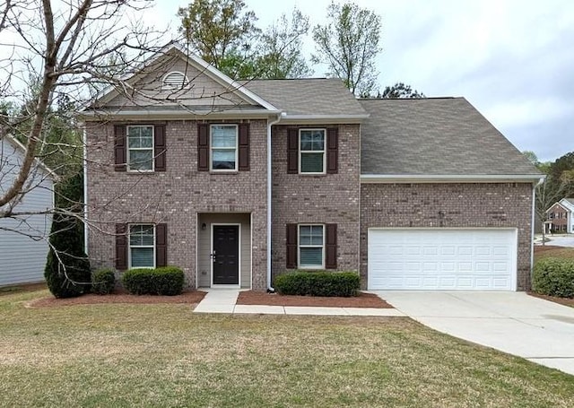 colonial-style house featuring a front yard, an attached garage, brick siding, and driveway