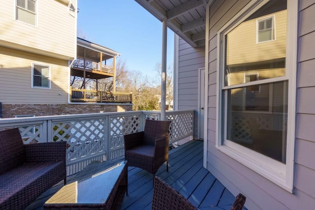 wooden balcony featuring a deck