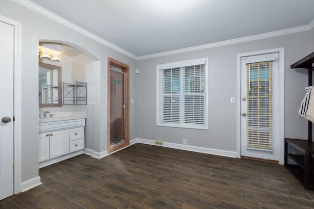 interior space with crown molding and dark hardwood / wood-style flooring