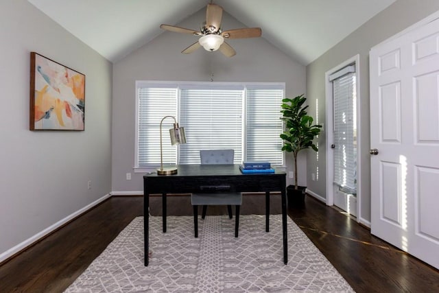 home office featuring lofted ceiling, dark wood-type flooring, ceiling fan, and plenty of natural light