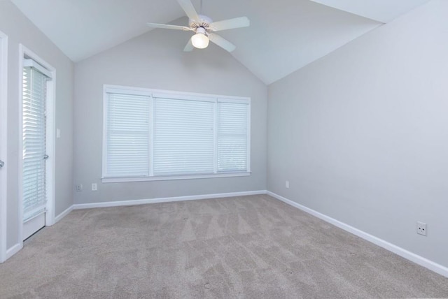 unfurnished room featuring lofted ceiling, light carpet, and ceiling fan