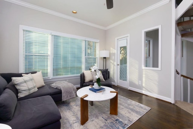 living room with crown molding, dark hardwood / wood-style floors, and ceiling fan