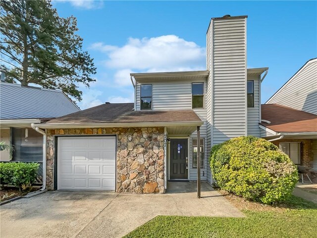 view of front of property with a garage