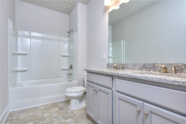 full bathroom featuring vanity, toilet, and shower / washtub combination