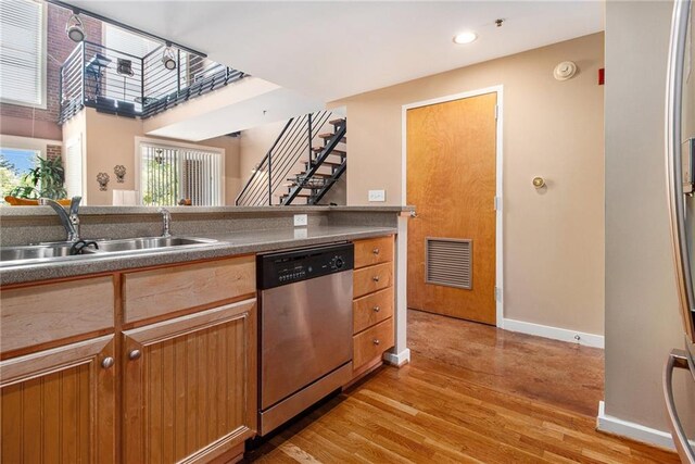 1133 Church St Unit 1, Covington, GA 30014 - kitchen with stainless steel dishwasher, a sink, baseboards, light wood-type flooring, and recessed lighting