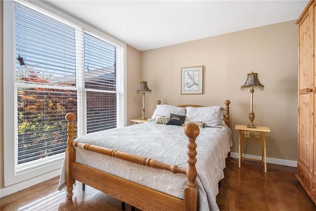 1133 Church St Unit 1, Covington, GA 30014 - bedroom with baseboards and concrete floors