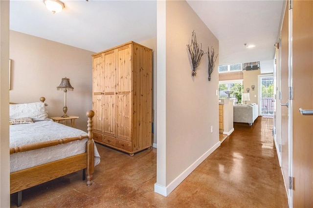1133 Church St Unit 1, Covington, GA 30014 - bedroom featuring concrete floors and baseboards
