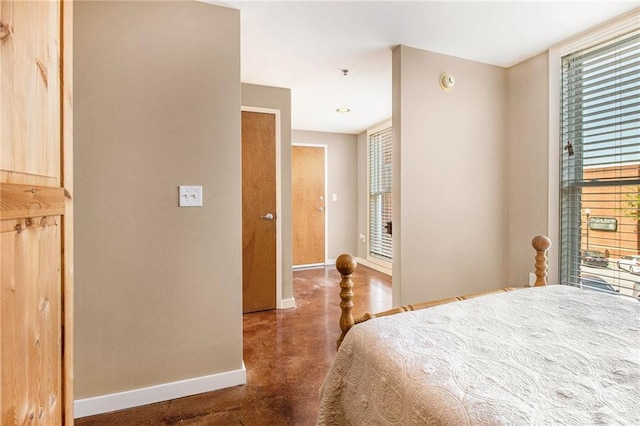 1133 Church St Unit 1, Covington, GA 30014 - bedroom featuring baseboards, finished concrete floors, and multiple windows