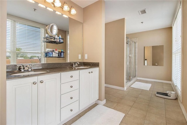 1133 Church St Unit 1, Covington, GA 30014 - full bath with tile patterned floors, a shower stall, double vanity, and baseboards