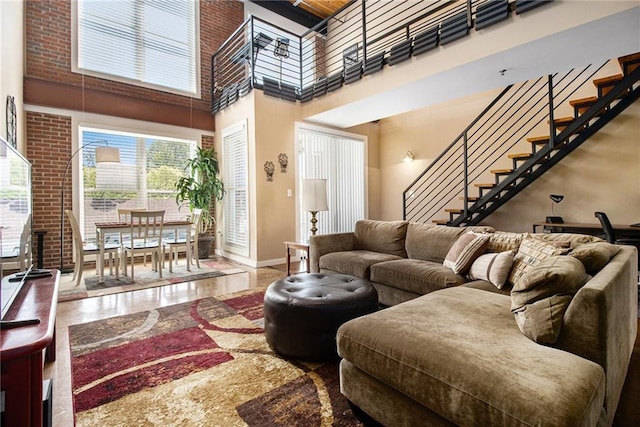 1133 Church St Unit 1, Covington, GA 30014 - living room with a high ceiling, stairs, plenty of natural light, and baseboards