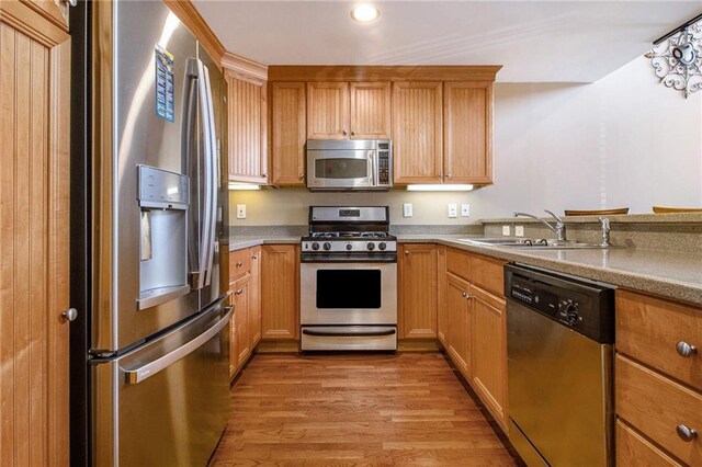1133 Church St Unit 1, Covington, GA 30014 - kitchen featuring stainless steel appliances, a sink, light wood finished floors, light countertops, and recessed lighting