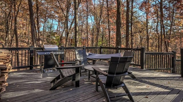 wooden terrace with a grill