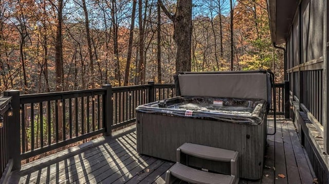 deck featuring a hot tub