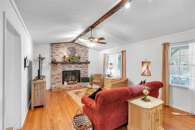 6863 Recreation Ln, Acworth, GA 30102 - living room featuring ceiling fan, light wood-type flooring, baseboards, and a fireplace