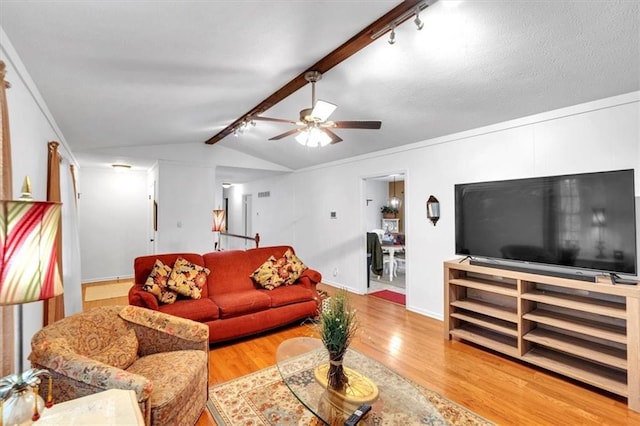 6863 Recreation Ln, Acworth, GA 30102 - living area featuring rail lighting, wood finished floors, a ceiling fan, and baseboards