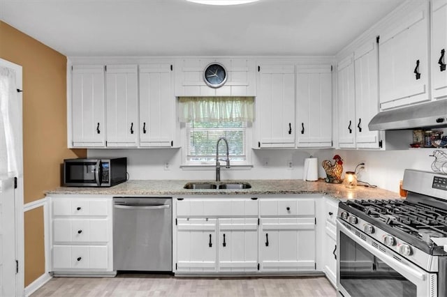 6863 Recreation Ln, Acworth, GA 30102 - kitchen featuring appliances with stainless steel finishes, a sink, under cabinet range hood, and white cabinets