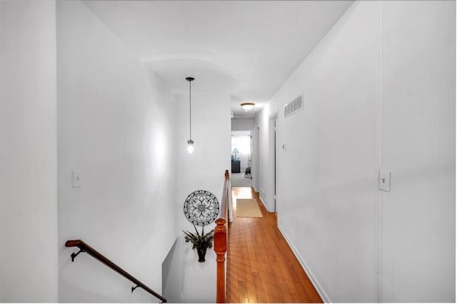 6863 Recreation Ln, Acworth, GA 30102 - hallway with an upstairs landing and light wood-style floors