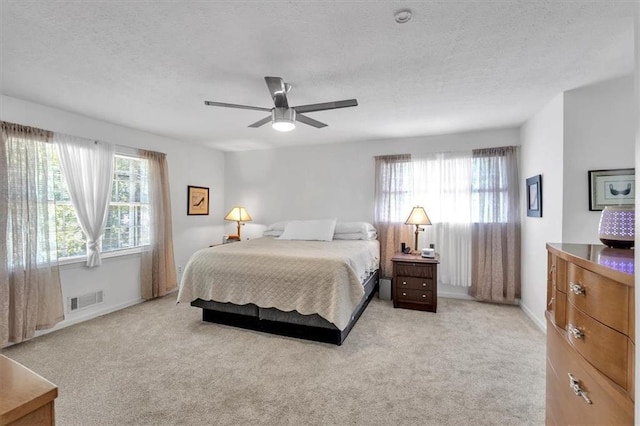 6863 Recreation Ln, Acworth, GA 30102 - bedroom with light carpet, a textured ceiling, baseboards, and a ceiling fan