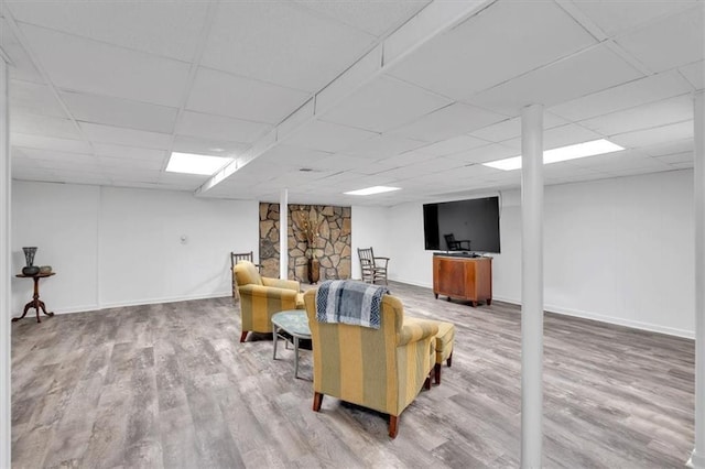 6863 Recreation Ln, Acworth, GA 30102 - living room with wood finished floors, a drop ceiling, and baseboards