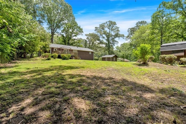 6863 Recreation Ln, Acworth, GA 30102 - view of grassy yard featuring a wooden deck