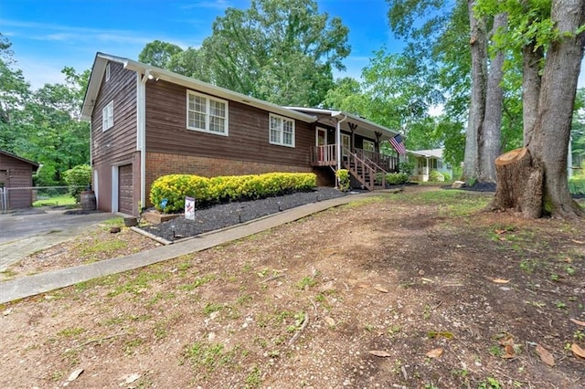 6863 Recreation Ln, Acworth, GA 30102 - ranch-style house with a garage, brick siding, asphalt driveway, covered porch, and stairs