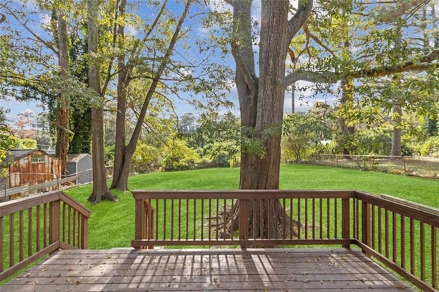 wooden terrace with a yard