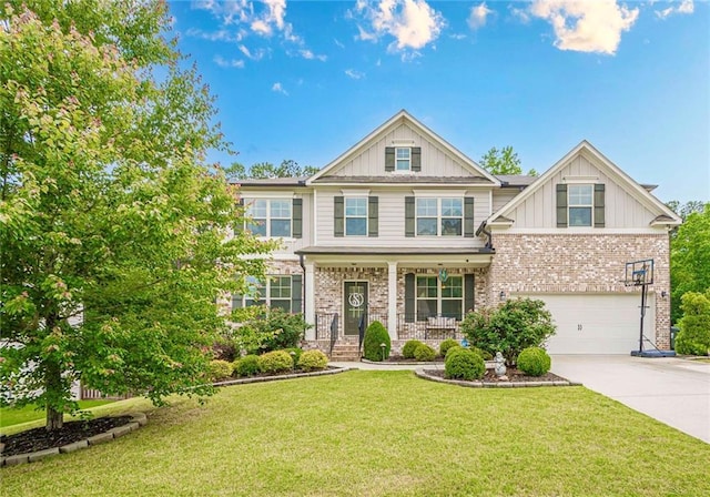 285 Turtle Rock Pl, Acworth, GA 30101 - craftsman-style home with board and batten siding, an attached garage, driveway, a porch, and a front lawn