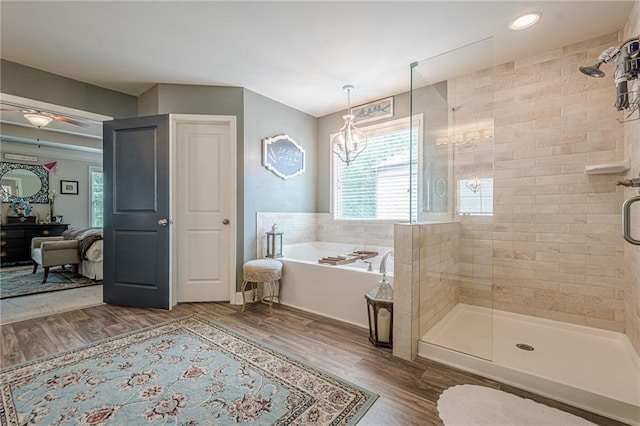 285 Turtle Rock Pl, Acworth, GA 30101 - full bathroom with plenty of natural light, a stall shower, a garden tub, wood finished floors, and recessed lighting