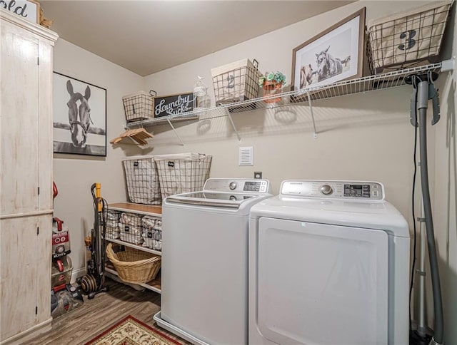 285 Turtle Rock Pl, Acworth, GA 30101 - laundry area with washing machine and dryer, wood finished floors, and cabinet space