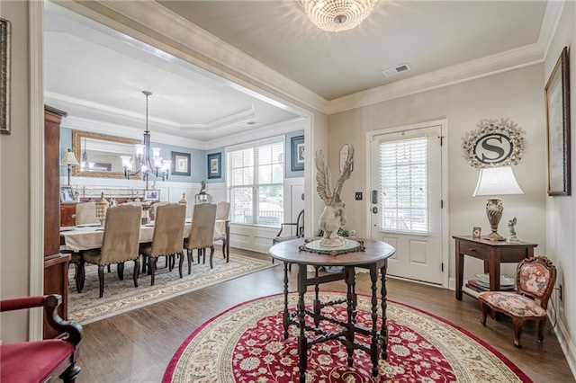 285 Turtle Rock Pl, Acworth, GA 30101 - dining room featuring a chandelier, wood finished floors, crown molding, and a wainscoted wall