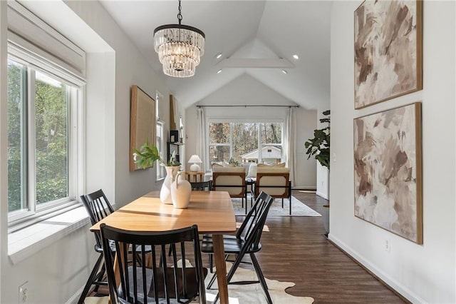 dining space with a notable chandelier, vaulted ceiling, and dark hardwood / wood-style floors