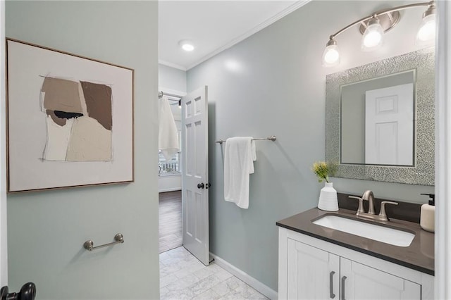 bathroom with vanity and crown molding