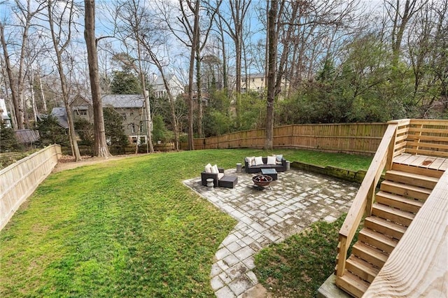 view of yard with a patio and an outdoor living space with a fire pit