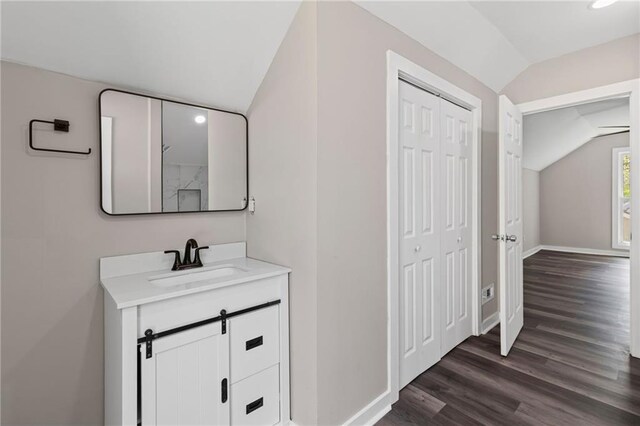 599 Daniel Ave, Decatur, GA 30032 - bathroom featuring baseboards, lofted ceiling, wood finished floors, and vanity