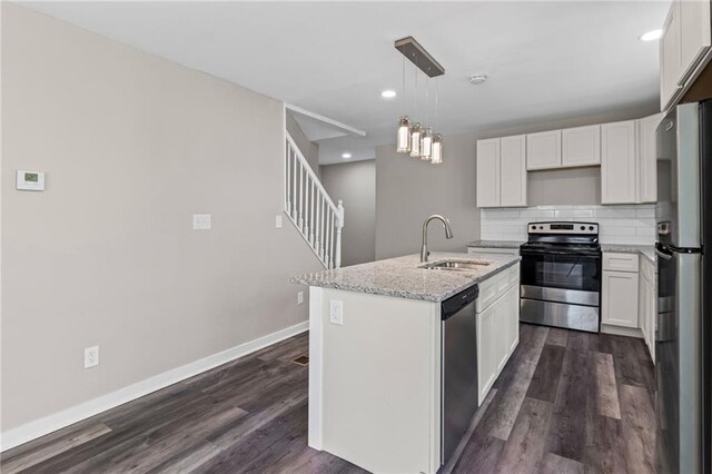 599 Daniel Ave, Decatur, GA 30032 - kitchen with dark wood-style floors, a sink, stainless steel appliances, and tasteful backsplash