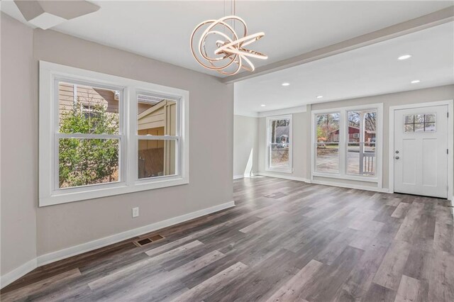 599 Daniel Ave, Decatur, GA 30032 - unfurnished dining area featuring baseboards, visible vents, an inviting chandelier, and plenty of natural light