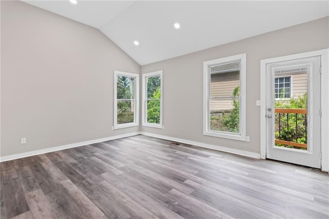 599 Daniel Ave, Decatur, GA 30032 - empty room with baseboards, lofted ceiling, wood finished floors, and recessed lighting