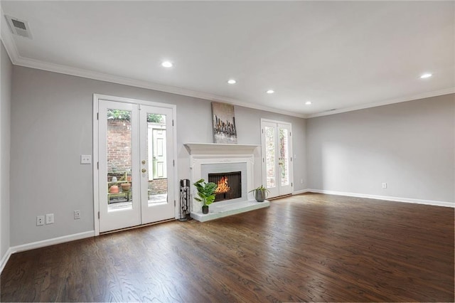 unfurnished living room with french doors, dark wood-type flooring, and ornamental molding