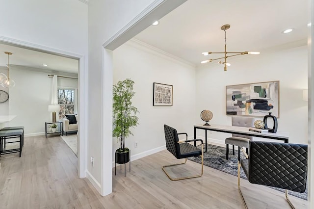 office area with baseboards, ornamental molding, wood finished floors, and an inviting chandelier