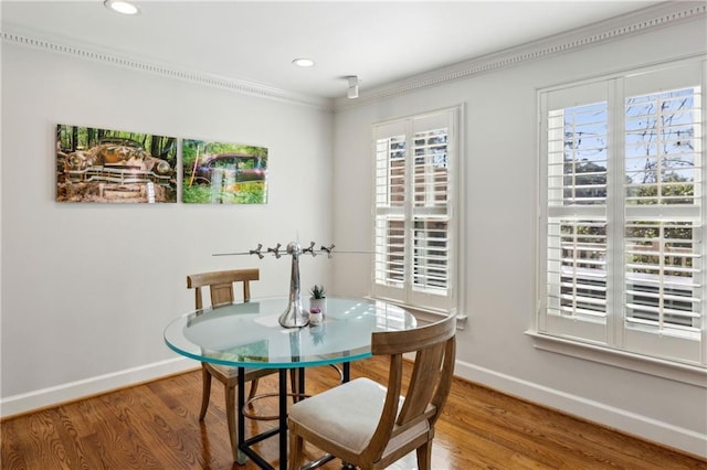 dining area featuring recessed lighting, baseboards, and wood finished floors