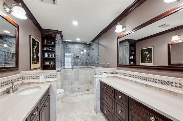 full bath with a stall shower, toilet, crown molding, and vanity