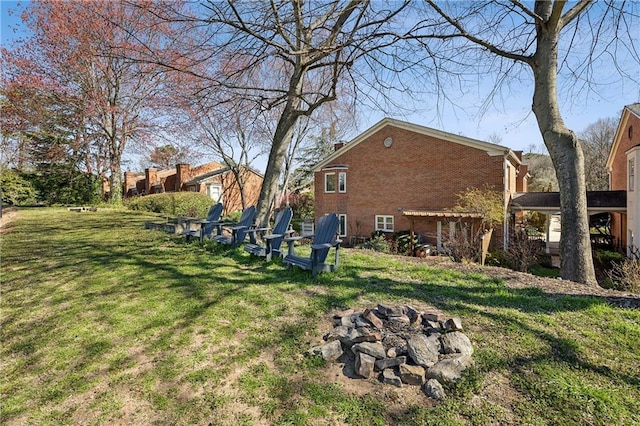 view of yard with a fire pit