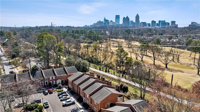 birds eye view of property featuring a city view