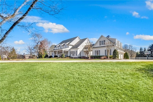 view of front of home featuring a garage, driveway, and a front yard