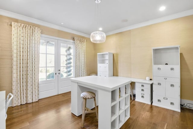 office with ornamental molding, recessed lighting, french doors, and wood finished floors