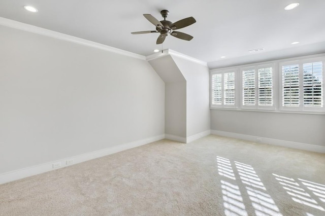 bonus room featuring recessed lighting, light colored carpet, and baseboards