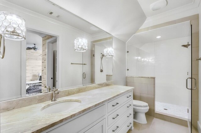 full bath with toilet, vanity, visible vents, a shower stall, and crown molding