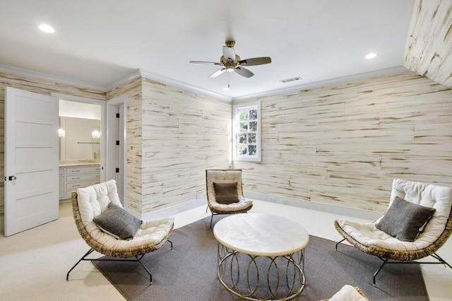 living area featuring visible vents, ornamental molding, a ceiling fan, and recessed lighting